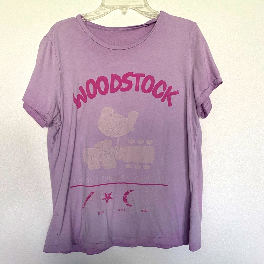 Pink Woodstock tshirt.